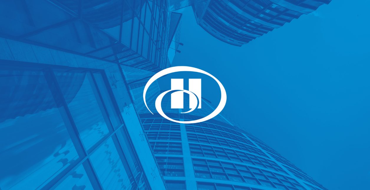 Hilton brand graphic with the white Hilton emblem over a blue-tinted hotel tower