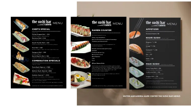 The Sushi Bar menus shown printed, three black menu panels on a taupe surface