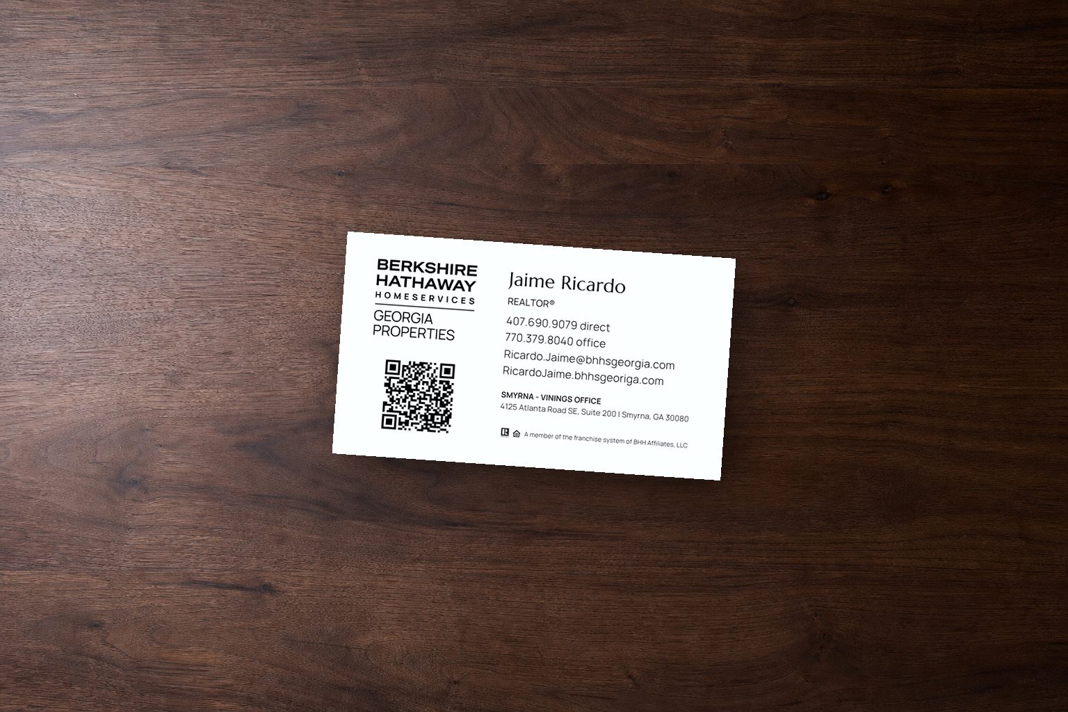 Jaime Ricardo business card mockup for Berkshire Hathaway HomeServices Georgia Properties on a dark walnut surface