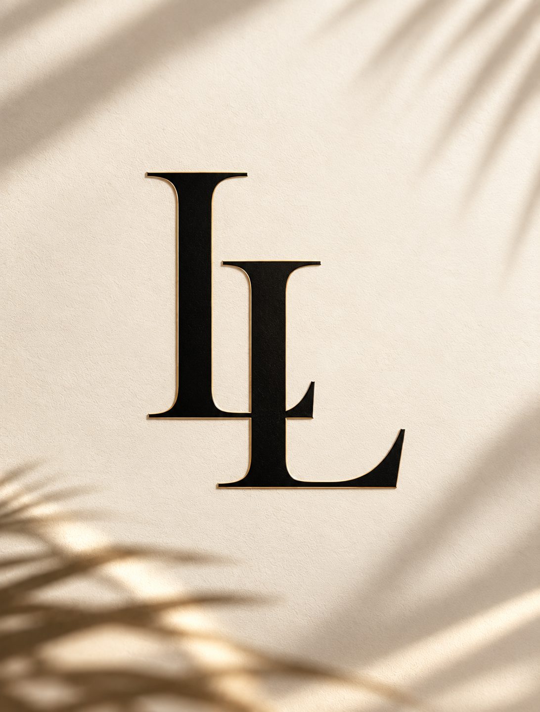 Lifestyles of Luxury LL monogram in black with gold edging on a cream background with palm leaf shadows